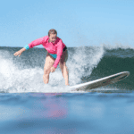 Rocks fly. Lifeguards warn. Fiji goes $. Records fall. Eisbach collapses. Emily triumphs.