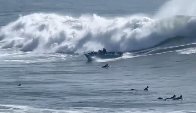 Heavy surf in California. Marine rescues. Big wave injuries. New surfing chairman. Monies for surf movies.